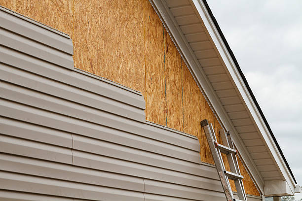 Professional Storm Damage Siding Repair technician working in Pleasantville, NY